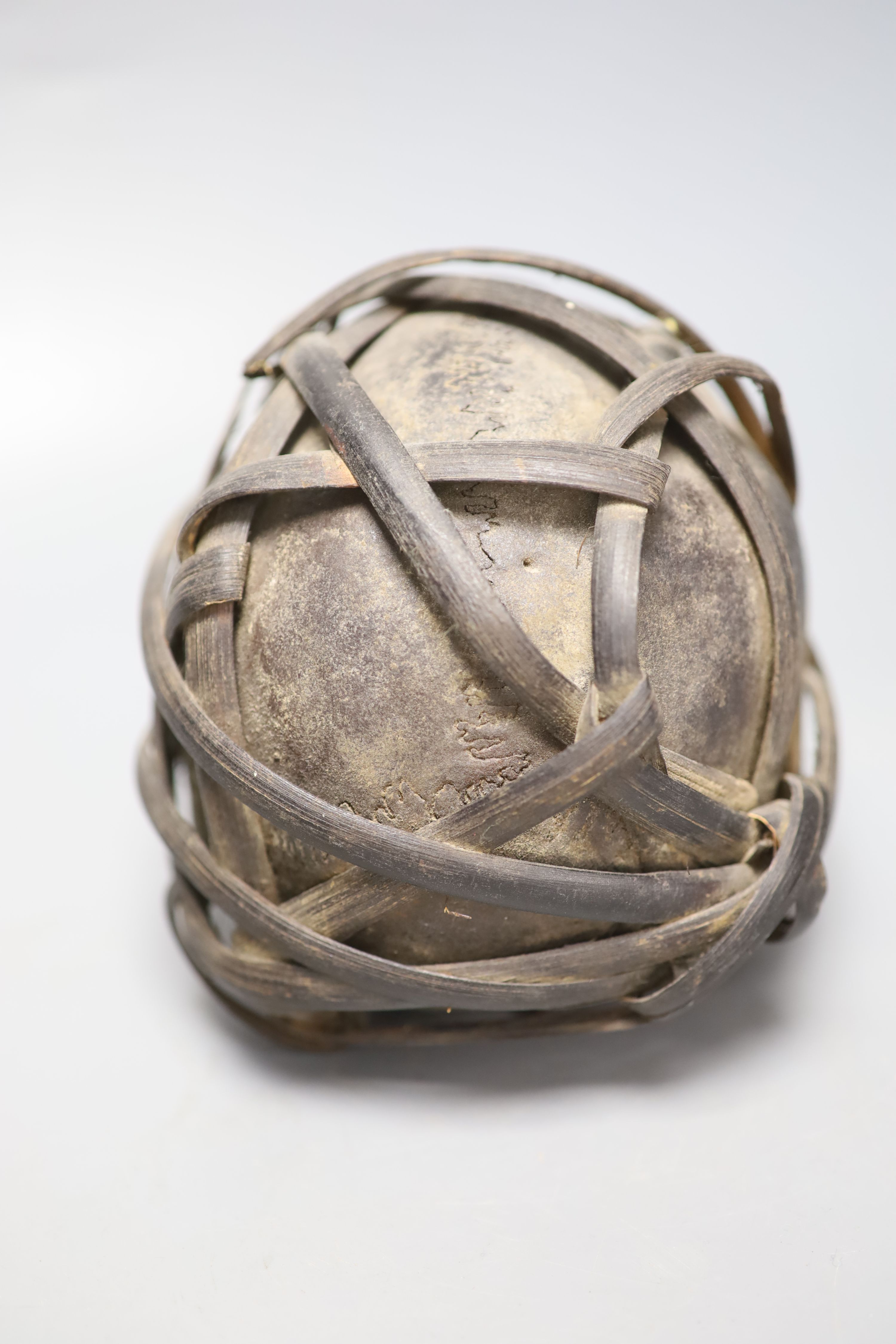 A bound Asmat human skull, possibly head hunters